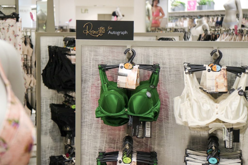 green bra hanging in the lingerie department of marks and spencer
