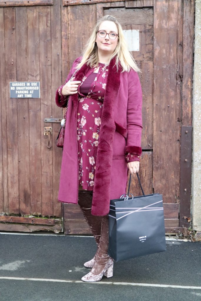 lucy with a sapce NK shopping bag