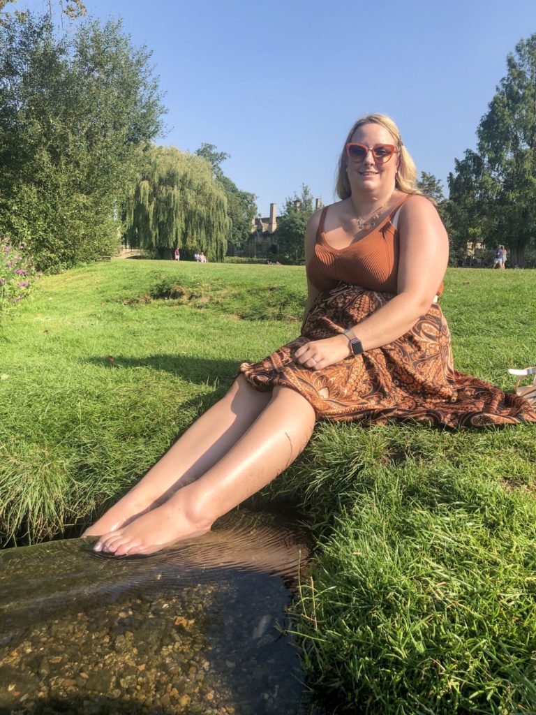 lucy dipping her toes in the stream