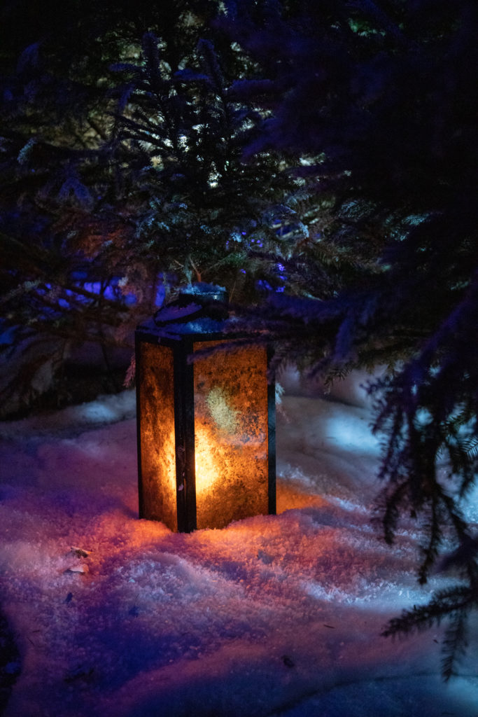 a lantern in the faux snow