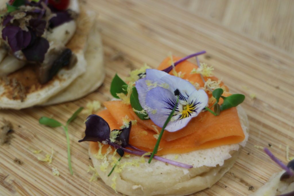 blini with carrot and a flower for decaration
